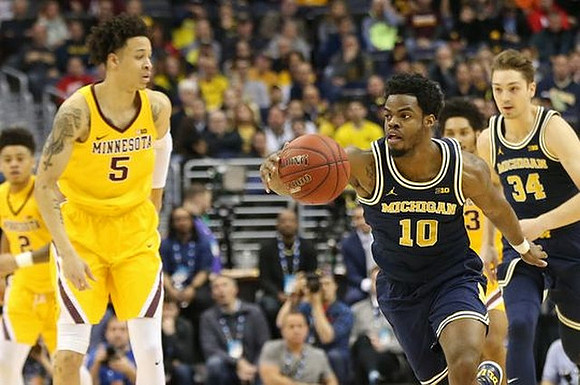 Derrick Walton Jr. (10) and Mark Donnal (34)