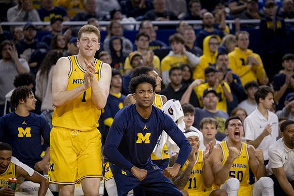 Danny Wolf (1), Jace Howard (7), and Michigan Team