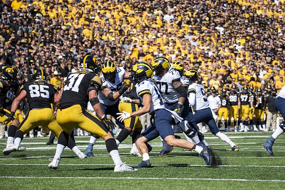 Zak Zinter (65), Roman Wilson (14), Trevor Keegan (77), and J.J. McCarthy (9)