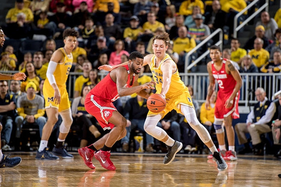 D.J. Wilson (5) and Mark Donnal (34)