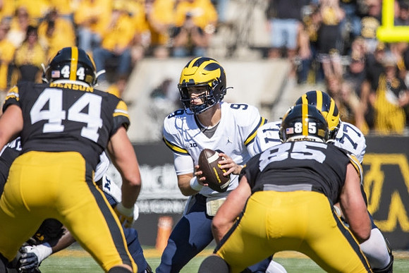 J.J. McCarthy (9) and Trevor Keegan (77)