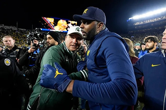 Michigan State Head Coach Jonathan Smith and Sherrone Moore