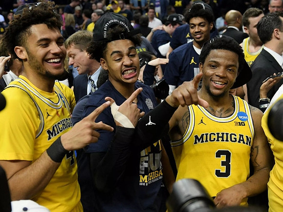 Isaiah Livers (4), Jordan Poole (2), Zavier Simpson (3), Luke Yaklich, and Ibi Watson (23)