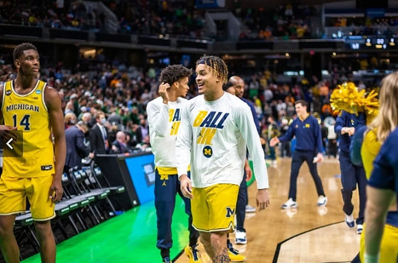 Moussa Diabate (14), Terrance Williams II (5), and Michigan Team