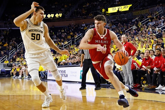 Vladislav Goldin (50) and Miami-Ohio Head Coach Travis Steele