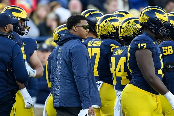 Sherrone Moore, Will Johnson (2), and Michigan Team