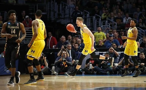 Charles Matthews (1), Moritz Wagner (13), and Zavier Simpson (3)