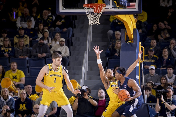 Hunter Dickinson (1) and Kobe Bufkin (2)