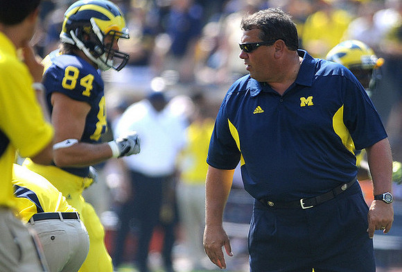 Steve Watson (84) and Brady Hoke