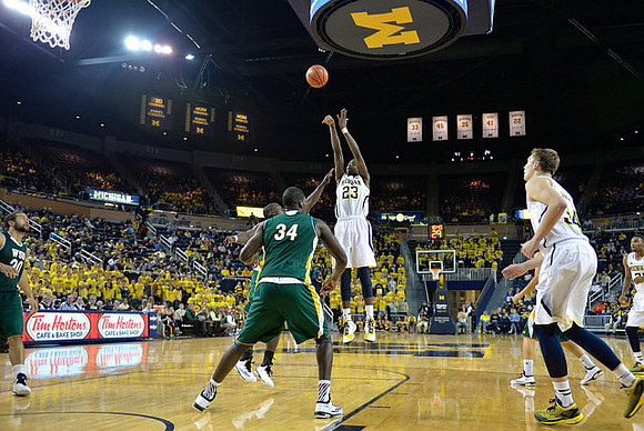 Caris LeVert (23), Mark Donnal (34), and Zak Irvin (21)