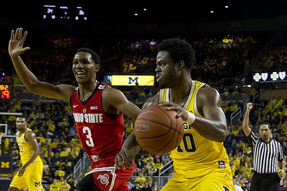 Derrick Walton Jr. (10) and Zak Irvin (21)