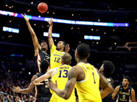 Muhammad-Ali Abdur-Rahkman (12), Moritz Wagner (13), and Charles Matthews (1)