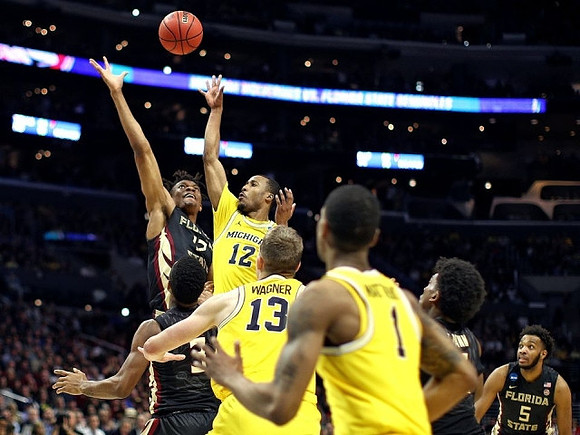 Muhammad-Ali Abdur-Rahkman (12), Moritz Wagner (13), and Charles Matthews (1)