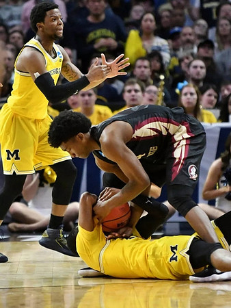 Zavier Simpson (3) and Muhammad-Ali Abdur-Rahkman (12)