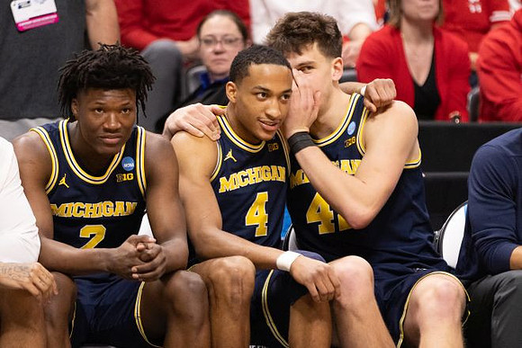 L.J. Cason (2), Nimari Burnett (4), and Will Tschetter (42)