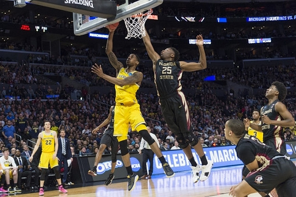 Duncan Robinson (22), Charles Matthews (1), and Zavier Simpson (3)