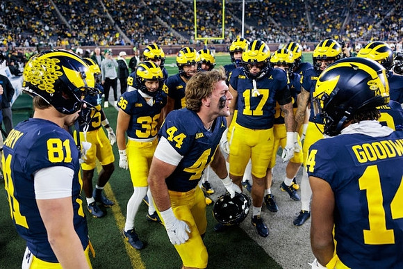 Max Bredeson (44) and Michigan Team