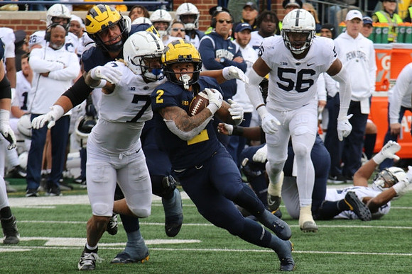 Trevor Keegan (77) and Blake Corum (2)