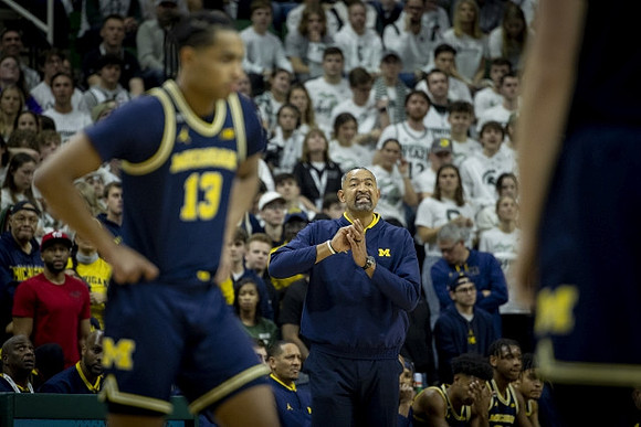 Jett Howard (13) and Juwan Howard