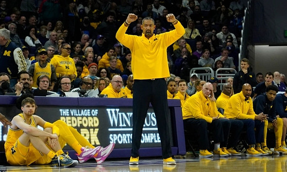 Joey Baker (15), Juwan Howard, Phil Martelli, Saddi Washington, and Jace Howard (25)