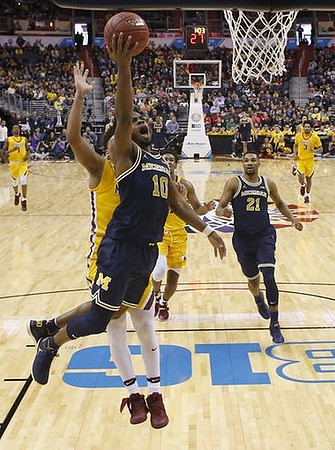 Derrick Walton Jr. (10) and Zak Irvin (21)