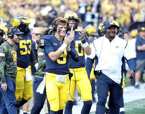 J.J. McCarthy (9), Ron Bellamy, and Trente Jones (53)