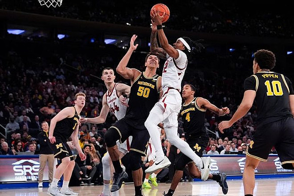 Danny Wolf (1), Vladislav Goldin (50), Nimari Burnett (4), and Justin Pippen (10)