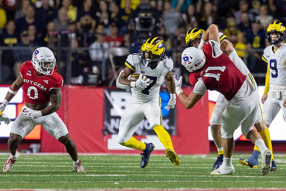 Donovan Edwards (7) and J.J. McCarthy (9)