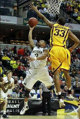 Trey Burke (3) and Matt Vogrich (13)