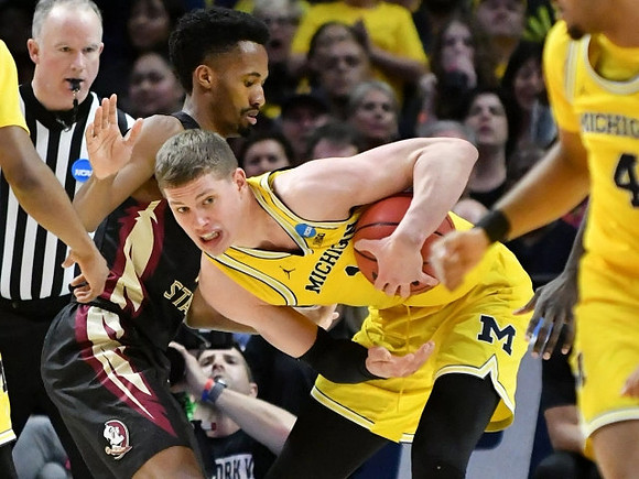 Moritz Wagner (13) and Isaiah Livers (4)