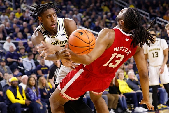 Tarris Reed Jr. (32) and Jett Howard (13)