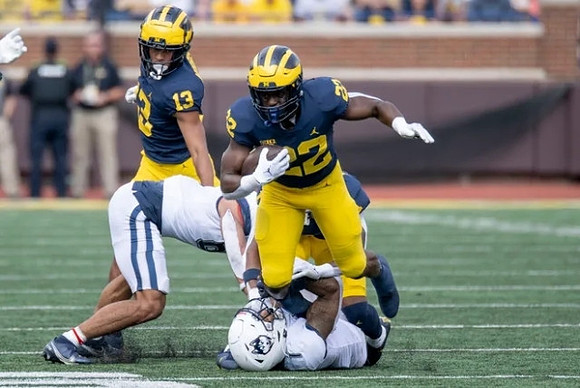 Tyler Morris (13) and Tavierre Dunlap (22)